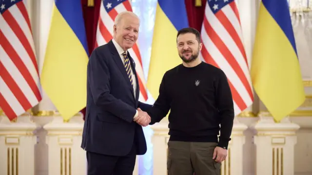 Joe Biden and Zelensky shake hands