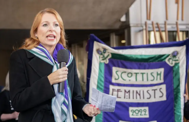 SNP Minister Ash Regan speaks at the For Women Scotland and the Scottish Feminist Network demonstration outside the Scottish Parliament in Edinburgh in December