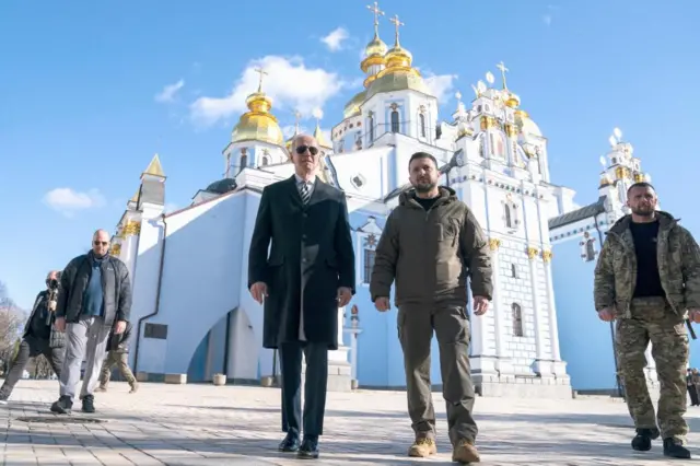 US President Joe Biden walks with Ukrainian President Volodymyr Zelensky at St Michael's Golden-Domed Cathedral during an unannounced visit in Kyiv, Ukraine, on 20 February 2023