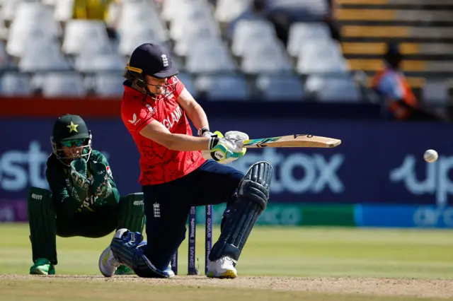 England's Nat Sciver-Brunt sweeps against Pakistan