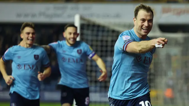 Ashley Barnes celebrates