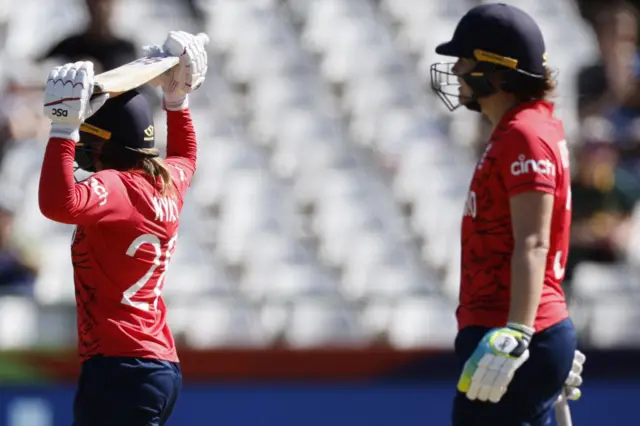 England's Danni Wyatt reacts in a frustrated manner after being dismissed against Pakistan