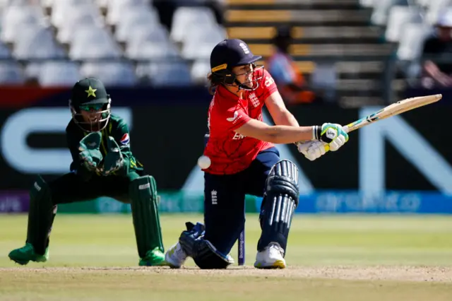 Nat Sciver-Brunt plays a sweep off Pakistan's Nashra Sandhu