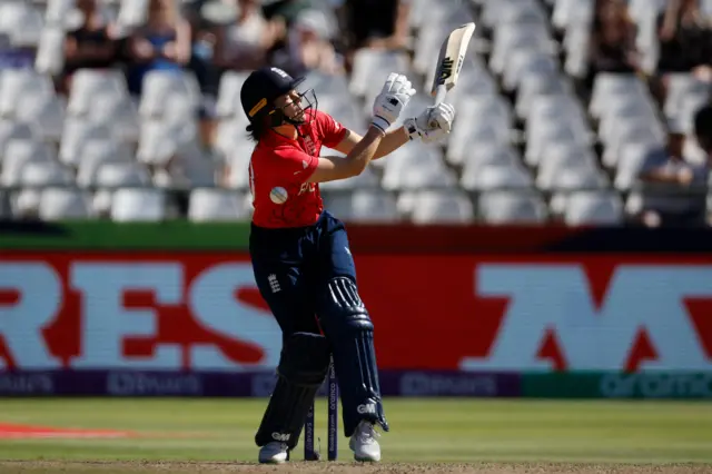 Amy Jones is hit in the stomach by the ball