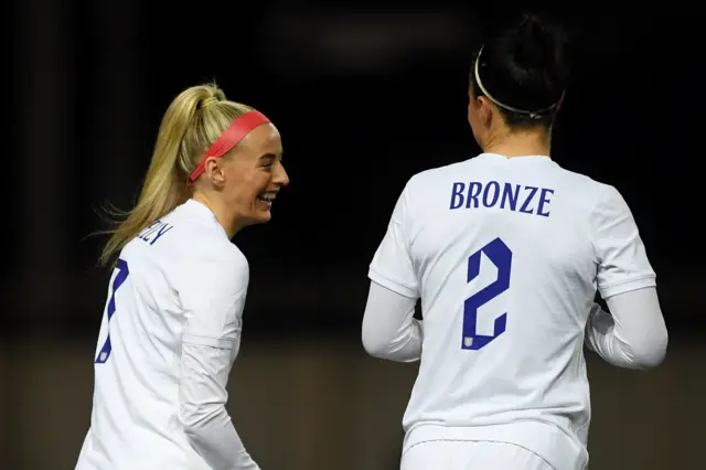 Chloe Kelly and Lucy Bronze celebrate