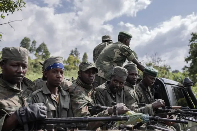 M23 soldiers leave leave Rumangabo camp after the meeting between EACRF officials and M23 rebels during the handover ceremony at Rumangabo camp in eastern Democratic Republic of Congo on January 6, 2023