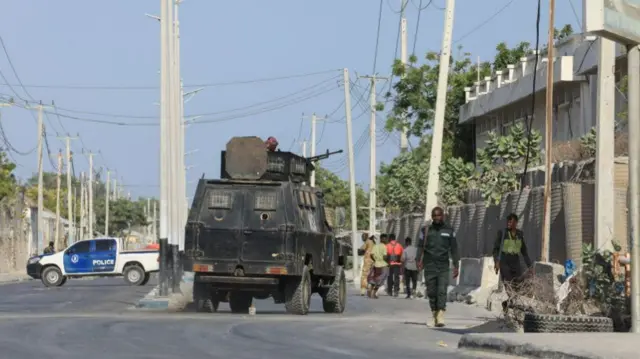 Security forces patrol outside a building which was attacked by suspected Al Shabaab militants in the Somalia's capital Mogadishu, on February 21, 2023.