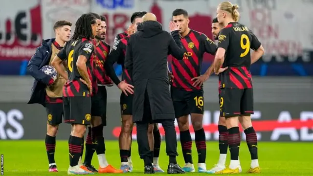 Pep Guardiola debriefed his players on the pitch at full time