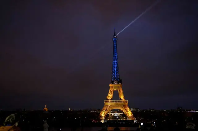 Eiffel Tower lit in the colours of the Ukrainian flag in a show of support