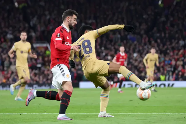 Bruno Fernandes tugs at the back of Balde, giving away a penalty.