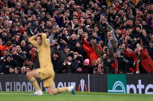 Manchester United fans cheer on the red devils.