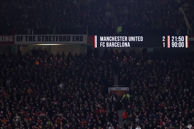 Scoreboard showing 2-1 at Old Trafford.