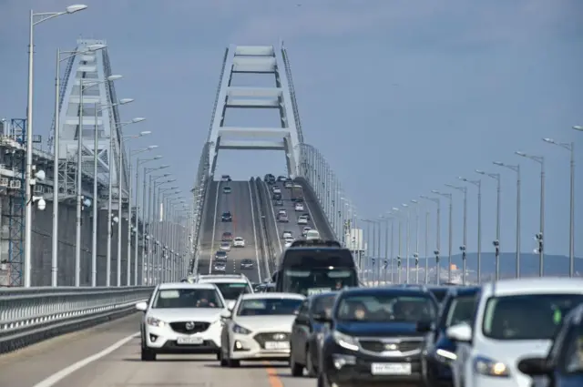 Cars drive across the Crimean Bridge