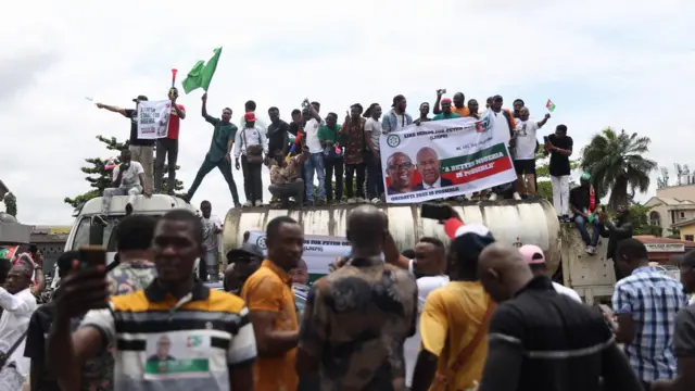 Supporters of Nigerian opposition candidate of the Labour party,Peter Obi (not in picture), are seen on a vehicle at a street procession in Ikeja district in Lagos, Nigeria, 01 October 2022.