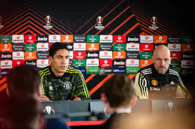 Raphael Varane speaks alongside Eric Ten Haag.