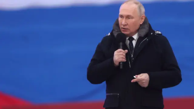 Putin speaks during a concert in Luzhniki Stadium on Wednesday