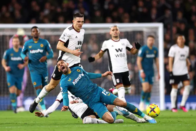 Wolves' Matheus Cunha is tackled by Fulham's Sada Lukic