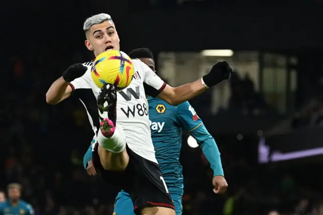Fulham midfielder Andreas Pereira controls the ball against Wolves