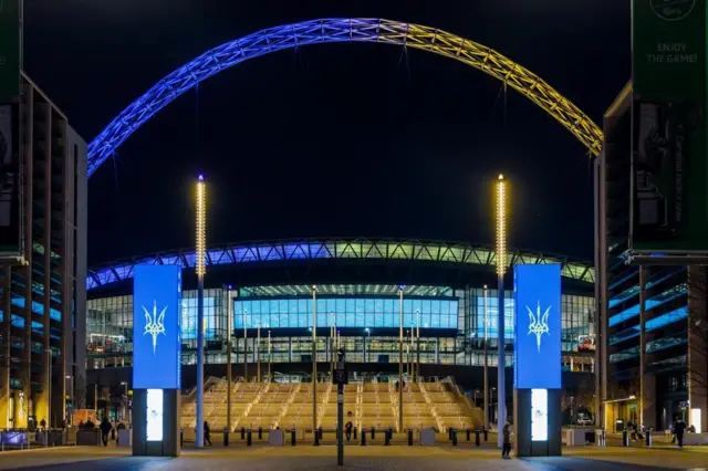 Wembley Stadium is illuminated in the colours of the Ukrainian flag