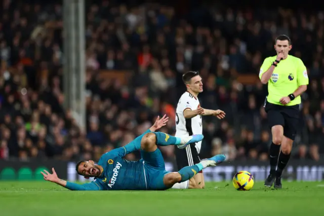 Matheus Cunha of Wolverhampton Wanderers is fouled by Joao Palhinha of Fulham