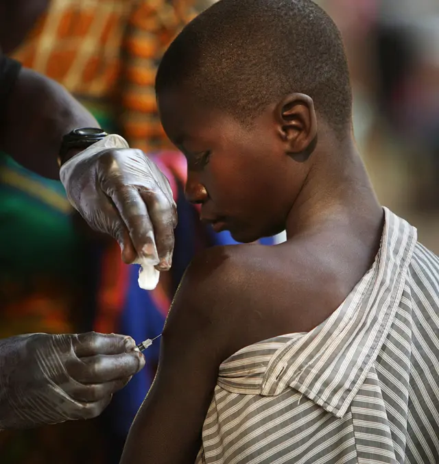 A boy receives a measles vaccine.