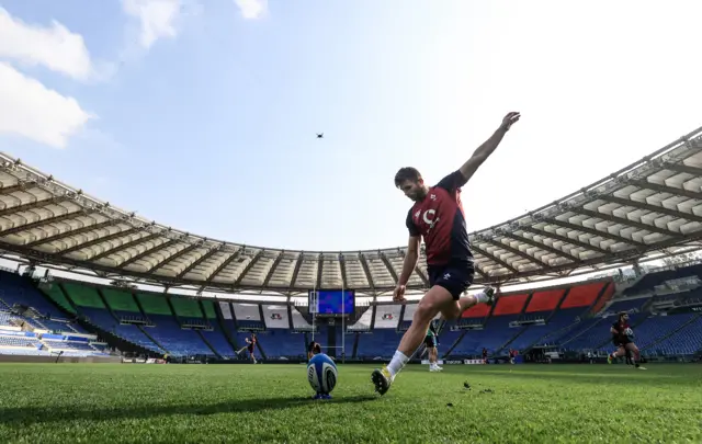 Ross Byrne takes a kick during training