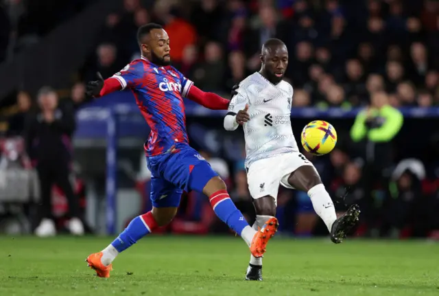 Liverpool's Naby Keita and Crystal Palace's Jordan Ayew challenge for the ball.