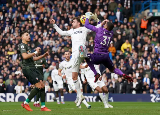Southampton goalkeeper Gavin Bazunu saves from Leeds United's Patrick Bamford