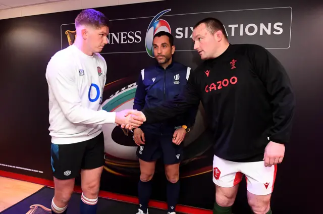 Wales captain Ken Owen and England captain Owen Farrell shake hands before kick-off.