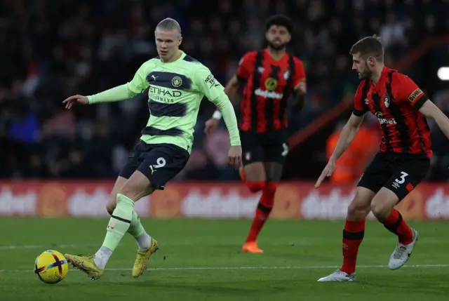 Erling Haaland passes the ball against Bournemouth
