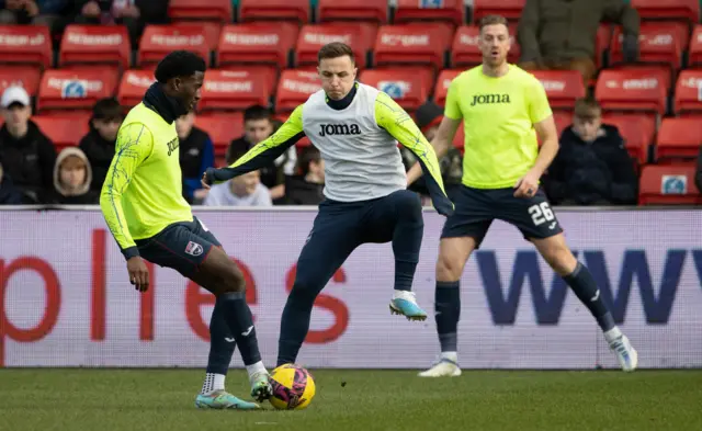 Nohan Kenneh and Eamonn Brophy warm up for Ross County