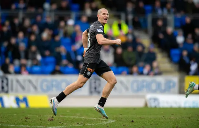 Alex Gogic celebrates