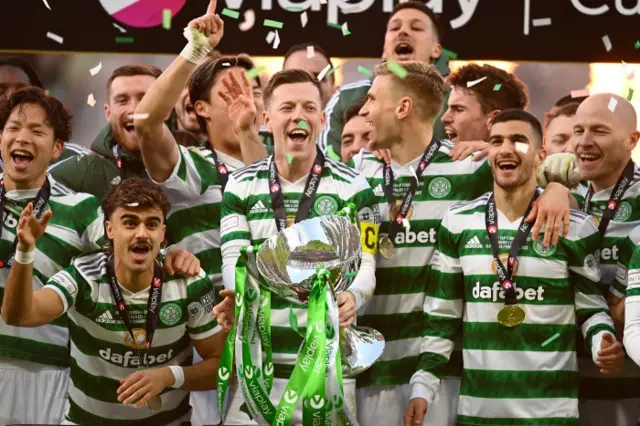 Celtic captain Callum McGregor lifts the League Cup