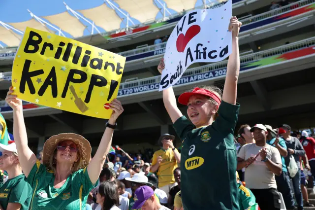 South Africa fans with posters