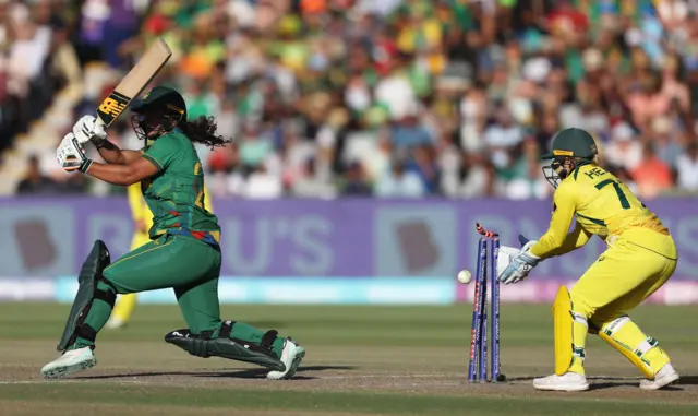 Chloe Tryon of South Africa is bowled by Jess Jonassen of Australia during the ICC Women's T20 World Cup Final match between Australia and South Africa at Newlands Stadium