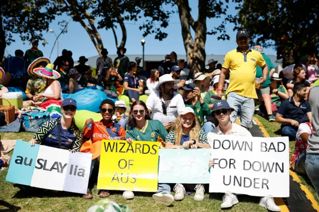 Fans at the T20 World Cup final with signs