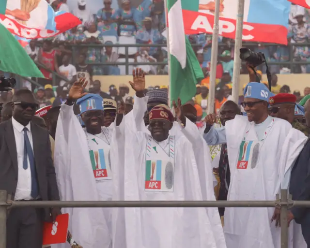 Presidential candidate of the All Progressives Congress (APC) Bola Tinubu (2nd R) and Nigerian President Muhammadu Buhari (2nd R) attend their final rally ahead of the Nigerian presidential election scheduled for Feb. 25, at the Teslim Balogun Stadium in Lagos, Nigeria on February 21, 2023