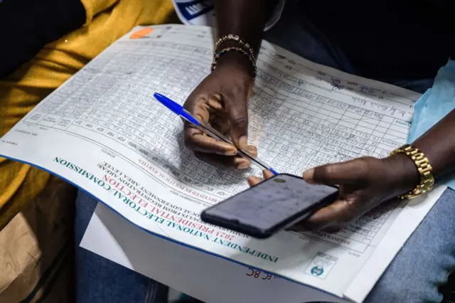 A presiding officer counts records from the Ikorodu local government area