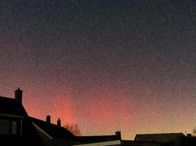 An orange sky over houses