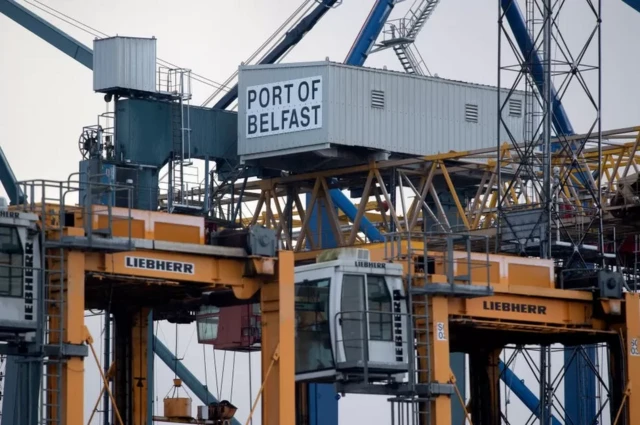 Harbour infrastructure, including a sign which reads "Port of Belfast"