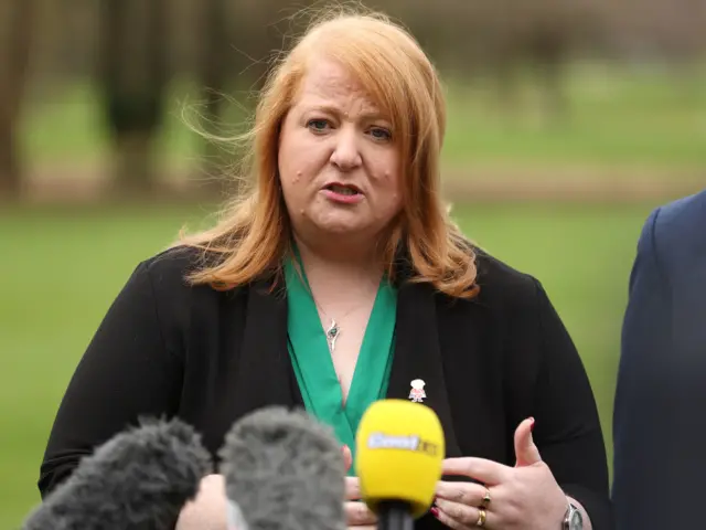 Naomi Long speaks to the media