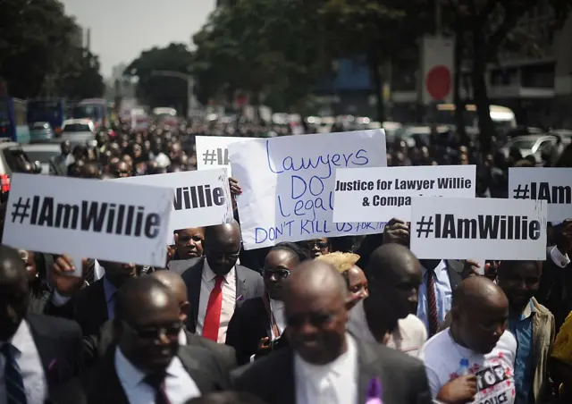 Hundreds of Kenyan lawyers march down a street in Nairobi on July 6, 2016 to protest against the extrajudicial killings of three men including a rights lawyer by Kenyan police.