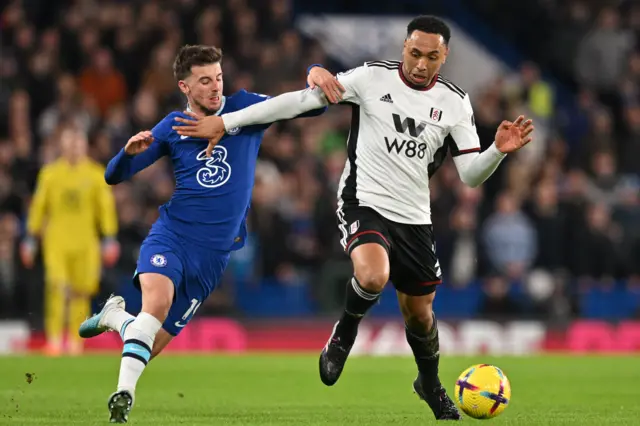 Kenny Tete competes for possession with Mason Mount