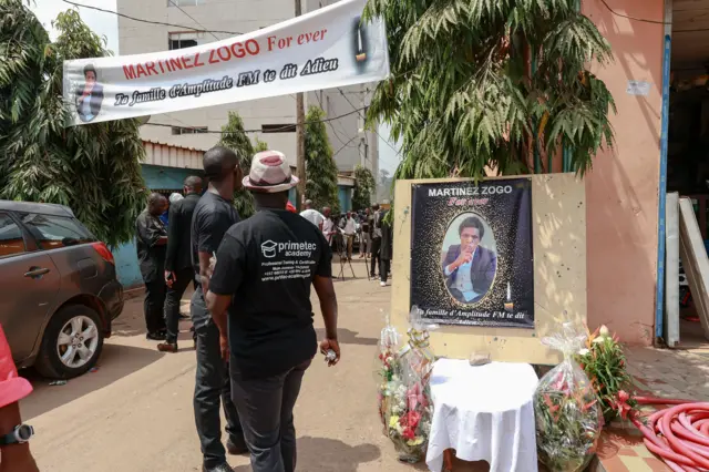 Mourners gather in the courtyard of Radio Amplitude FM, during a tribute ceremony for journalist Martinez Zogo, in the Elig Essono district of Yaounde on January 23, 2023.