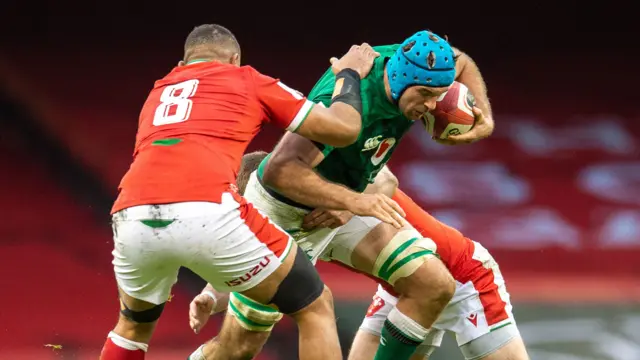 Tadhg Beirne is tackled by Taulupe Faletau