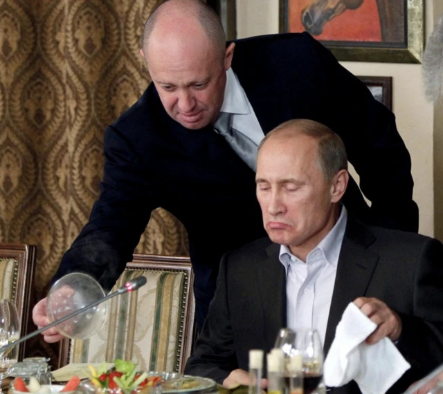 Yevgeny Prigozhin in 2011 helping to serve food to President Putin