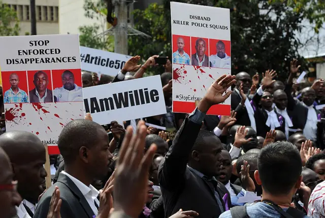 Hundreds of Kenyan lawyers march down a street in Nairobi on July 6, 2016 to protest against the extrajudicial killings of three men including a rights lawyer by Kenyan police.