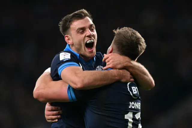 Huw Jones celebrates