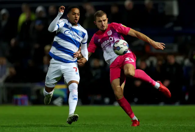 Chris Willock of QPR and Michal Helik of Huddersfield