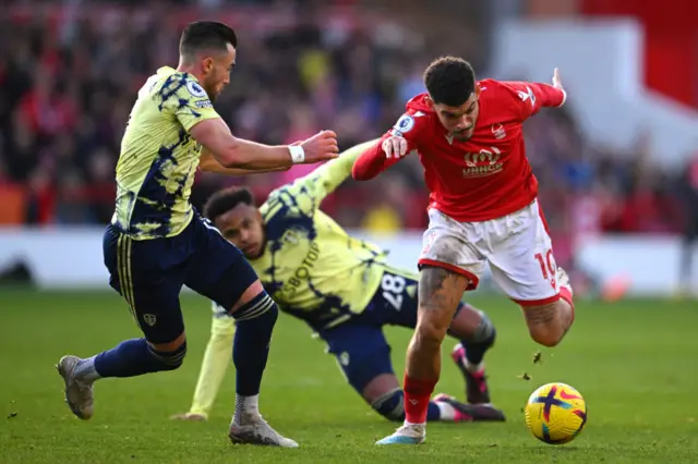 Morgan Gibbs-White is challenged by Weston McKennie and Jack Harrison